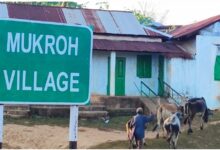 A signboard saying Mukroh Village