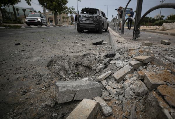 A road is seen damaged by a rocket fired from the Gaza Strip, in Ashkelon, on Monday. UNI