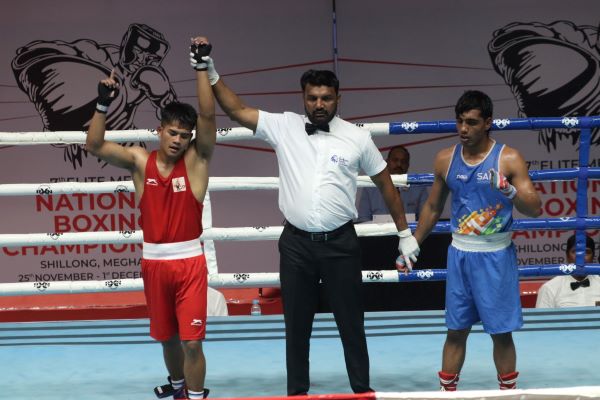 Meghalaya's Badonkupar Synnah (left) after being declared the winner of his bout.