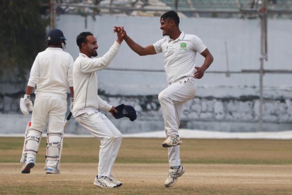 Meghalaya's Ram Gurung (right) is congratulated by captain Kishan Lyngdoh on taking a wicket. Photo sourced