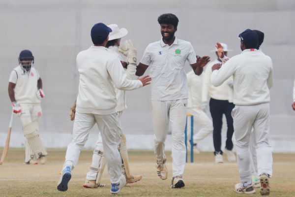 Meghalaya's PM Santhosh (centre) celebrates his fifth wicket. Photo sourced