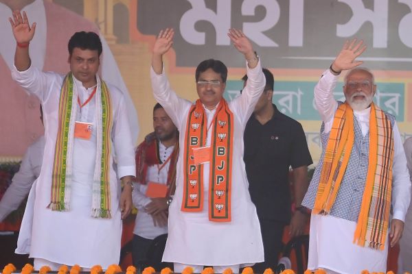 Narendra Modi with Tripura chief minister Manik Saha (centre) and BJP candidate Biplab Deb campaign in Agartala on Wednesday. UNI