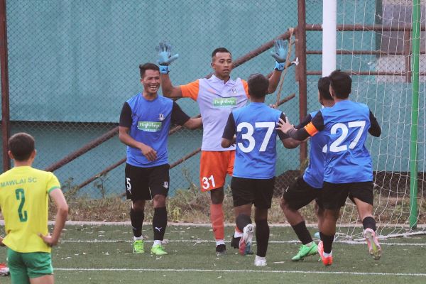 Rangdajied United goalkeeper Kerichard L Marshillong celebrates with teammates after denying a penalty by Mawlai's Brolington Warlarpih (not seen in the picture). Photo sourced