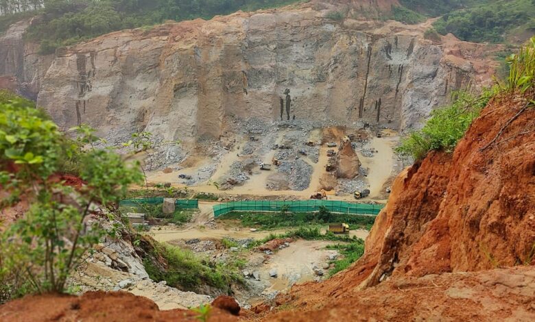 A stone quarry near the village has almost destroyed a forested hill. Photo by MM