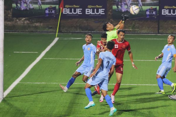 Laitkor's goalkeeper punches the ball away. Photo sourced