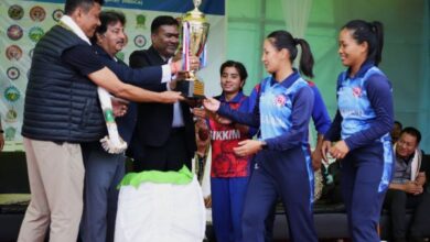 From left - Director of Sports & Youth Affairs Dikki D Shira and MCA's Naba Bhattacharya hand over the trophy to the players of Sikkim and Nagaland. Photo sourced