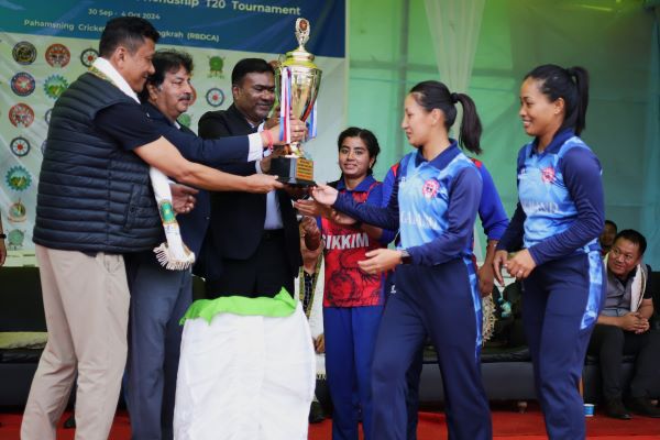 From left - Director of Sports & Youth Affairs Dikki D Shira and MCA's Naba Bhattacharya hand over the trophy to the players of Sikkim and Nagaland. Photo sourced