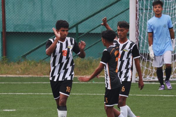 Mawlai's Khrawkupar Jana (left) is congratulated by teammates after scoring. Photo sourced