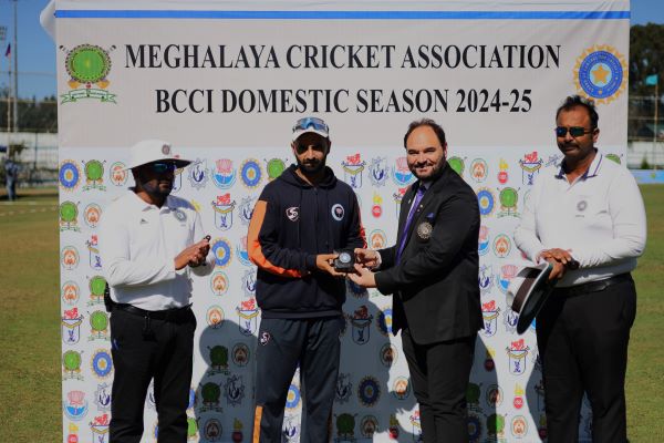 Jammu and Kashmir's Auqib Nabi is presented with the Player of the Match award. Photo sourced