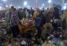 People carry a victim of the stampede at Prayagraj. UNI photo