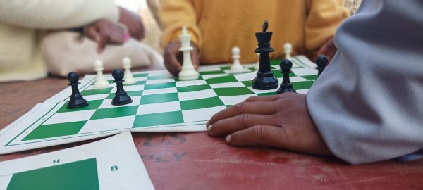 Young players at the chess booth at Shad Lyngdoh in Rangthylliang village. Photo by MM