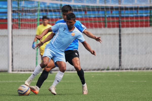 Laitkor's Samborwell Mynsong (light blue) in action against Rangdajied United. Photo sourced