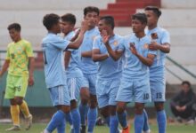 Laitkor's Sandy Kharkongor (No. 10) is congratulated after scoring. Photo sourced