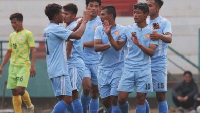 Laitkor's Sandy Kharkongor (No. 10) is congratulated after scoring. Photo sourced