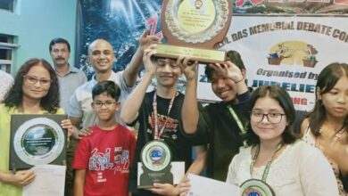 Dr MM Das Memorial Debate Championship trophy, 2025, being handed over by Mrinmoy Das and Rishaan Das to the winning team from St Edmund’s College. Photo sourced