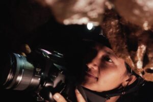 Banyllashisha Wankhar documenting the cave ecosystem. Image courtesy of Lind Horam. Fiirst published in Mongabay