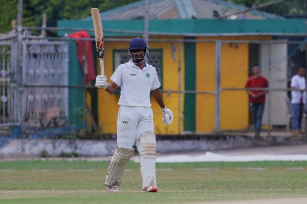 Meghalaya's Manish Sharma raises his bat on reaching 50. Photo sourced