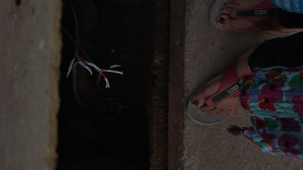 A woman stands near a public borewell in Bhagirathpura in Indore. Photo by author