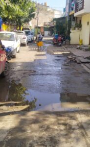Overflowing water from the drainage floods the lane at Prajapat Nagar in Indore on Monday. Photo by author