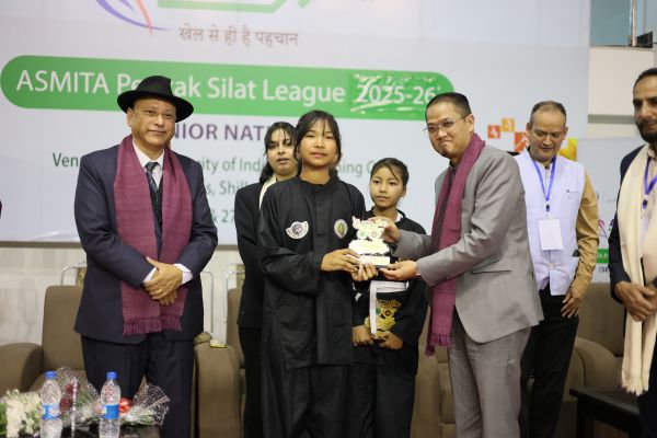 Sports and Youth Affairs Minister Wailadmiki Shylla felicitates two Meghalaya athletes. Photo sourced