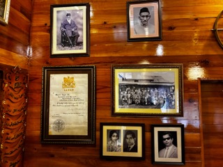 Amjad Ali and his family's memories adorn the wooden wall of the 150-year-old house in Laban. Photo by MM