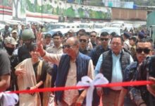 Manipur Chief Minister Y. Khemchand Singh waves to people as he arrives to inaugurate a multi-level parking area during his visit to Senapati, Manipur on Friday. Photo sourced