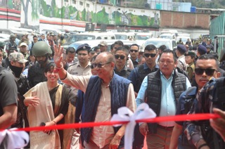 Manipur Chief Minister Y. Khemchand Singh waves to people as he arrives to inaugurate a multi-level parking area during his visit to Senapati, Manipur on Friday. Photo sourced