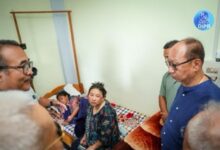 Y Khemchand Singh with a displaced family at Makhan in Kangpokpi on Thursday. Photo courtesy DIPR Manipur