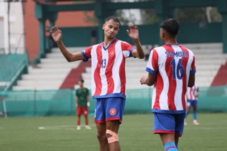 Langsning's Mebanshngain Kurkalang (left) celebrates after scoring. Photo sourced